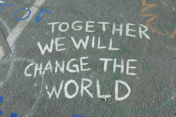 'Together we will change the world' message written on the ground.